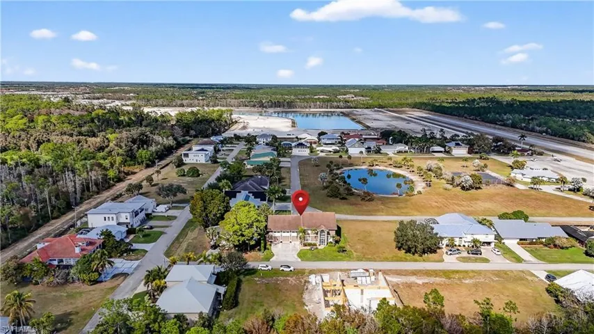 Aerial view of residential area featuring a large body of water