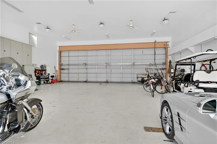 Garage featuring a ceiling fan