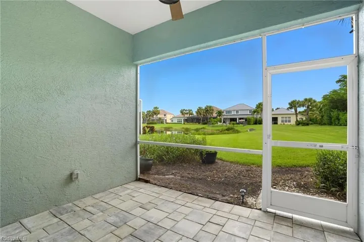 Unfurnished sunroom featuring a residential view