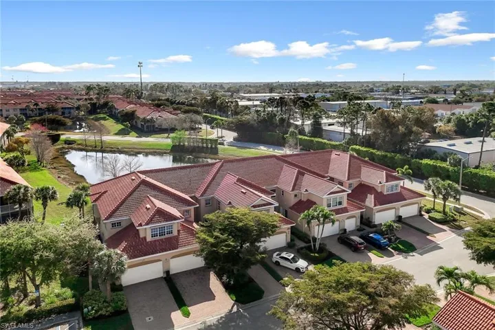 Aerial perspective of suburban area with a nearby body of water
