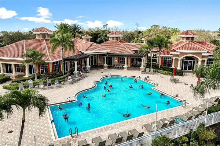 Community pool with a patio
