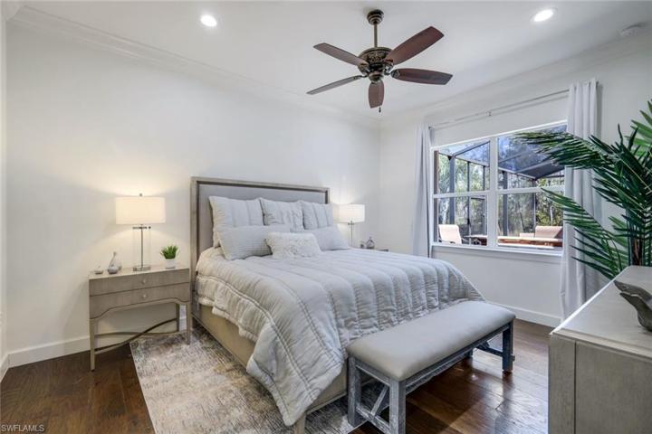 Primary Bedroom with wood flooring