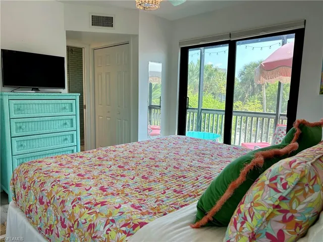Sliding glass doors opening to an exterior balcony