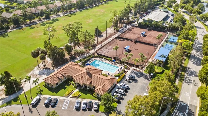Birds eye view of fitness center, tennis courts, pickleball courts