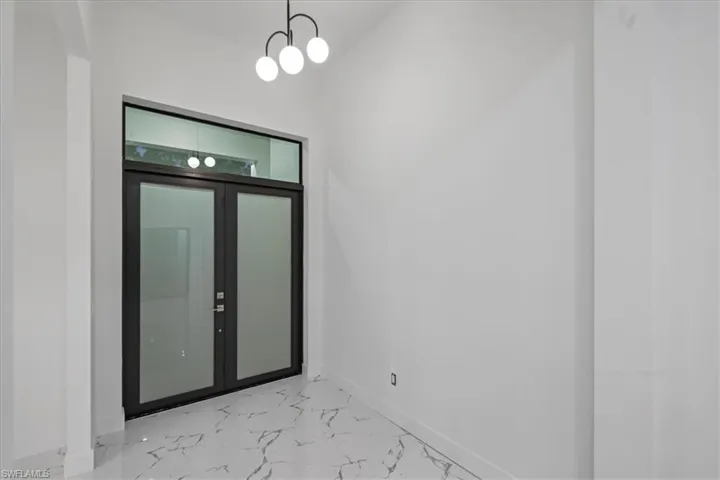 Empty room with marble finish floor and baseboards