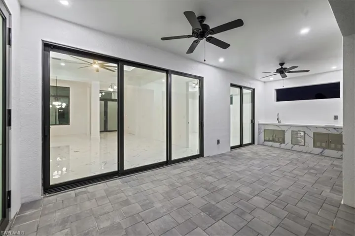 View of patio with ceiling fan