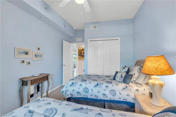 Bedroom featuring a closet, carpet flooring, and a ceiling fan
