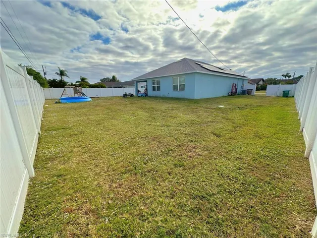 View of yard with a pool
