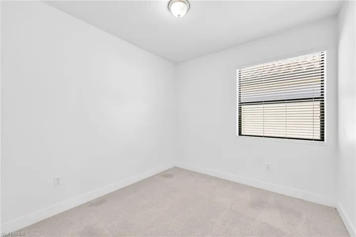 bedroom featuring carpet and a closet