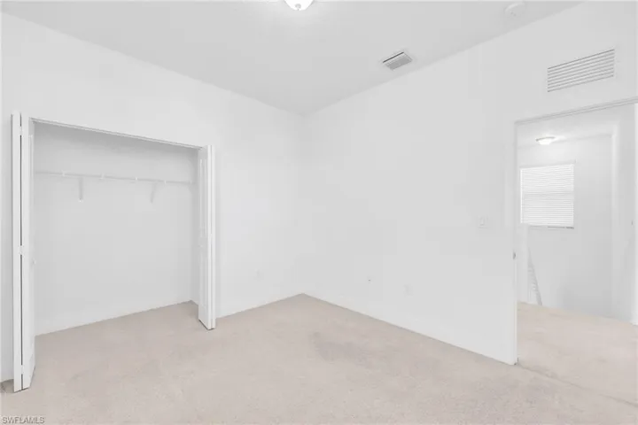 bedroom with carpet flooring and a closet