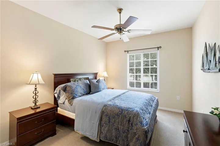 Guest bedroom number two with large walk in closet and lake view.