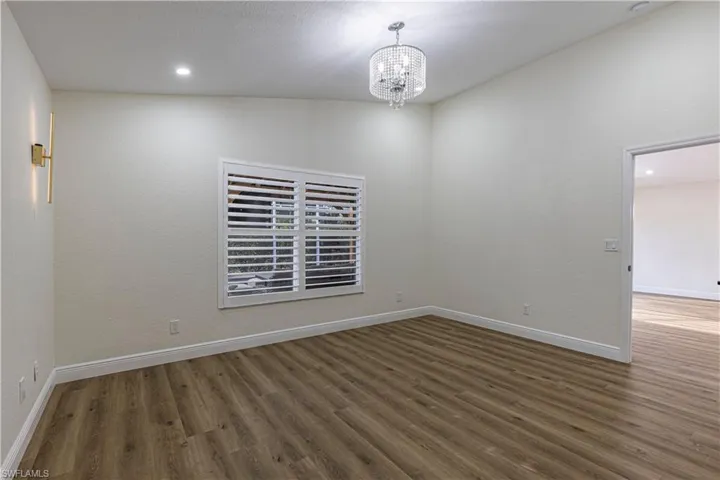 Master en-suite with vaulted ceilings and chadelier