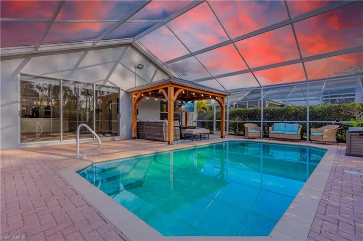 Outdoor Lanai & Pool with covered Gazebo that stays with home