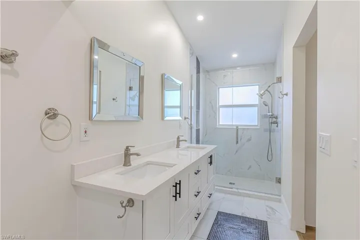 Master Bath with dual vanities and glass enclosed shower