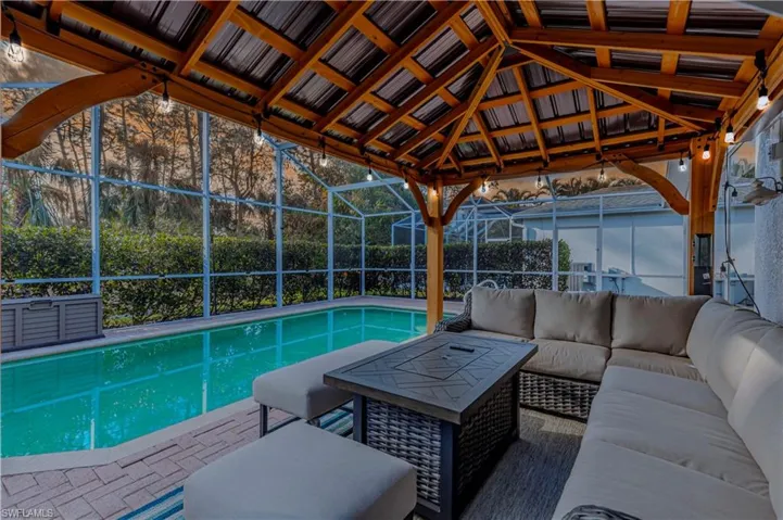 Relax under the covered Gazebo that stays with the home aling with the outdoor furniture and TV