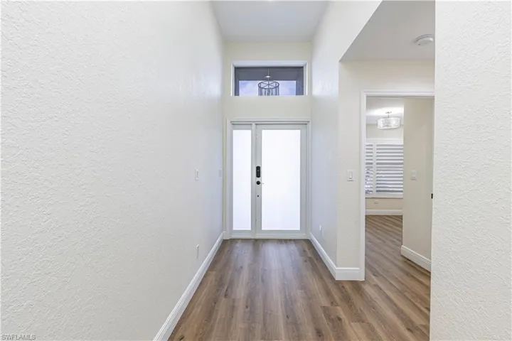 Front entryway foyer with custom glass front door