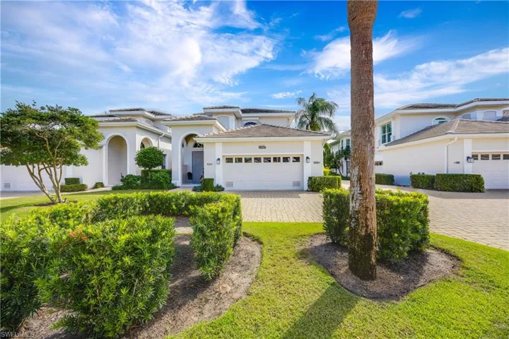 Mediterranean / spanish-style house featuring stucco siding, a garage, and decorative driveway