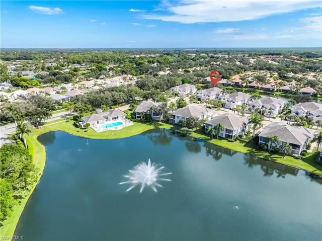 Aerial perspective of suburban area with a nearby body of water