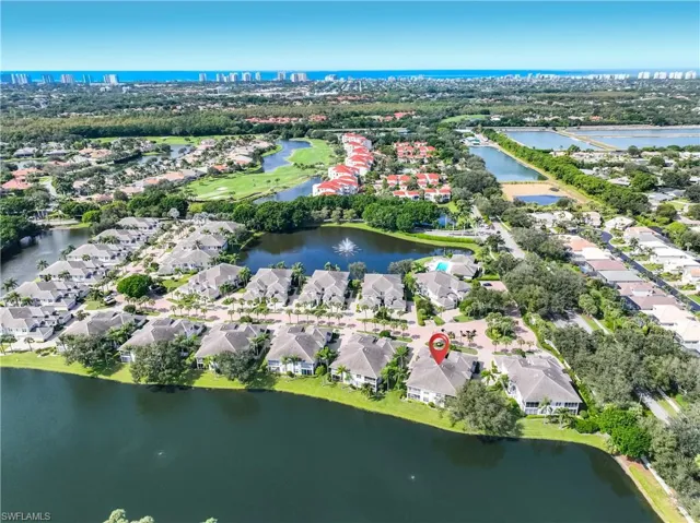 View of property location featuring a nearby body of water and nearby suburban area