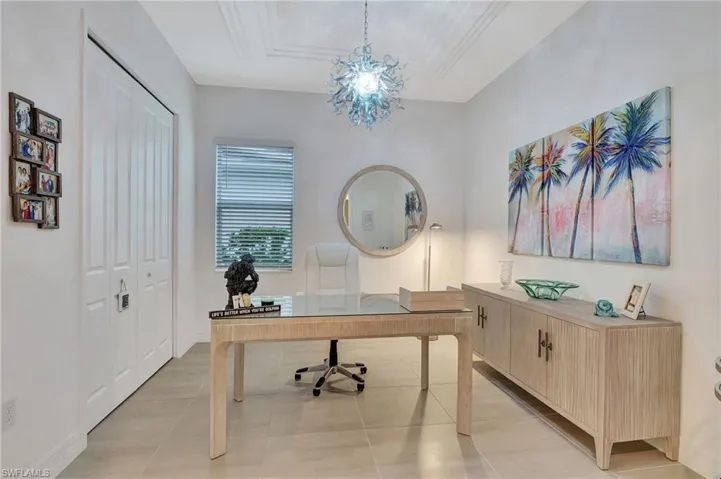 View of Office from Foyer featuring a Custom chandelier