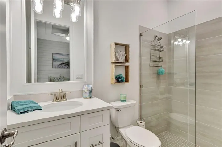 Bathroom with walk in shower, and vanity