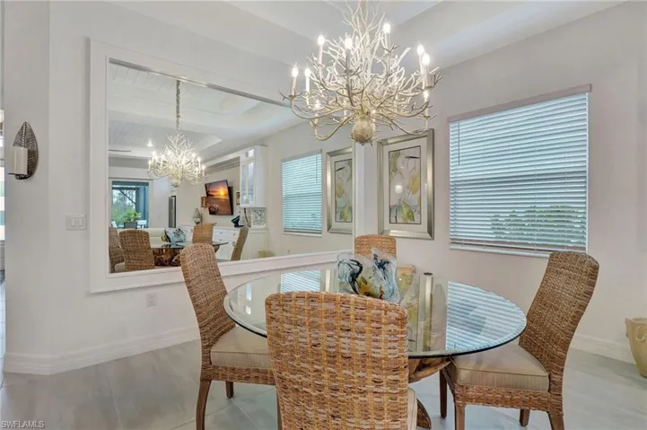 Dining Area featuring Full Wall Mirror and Trim