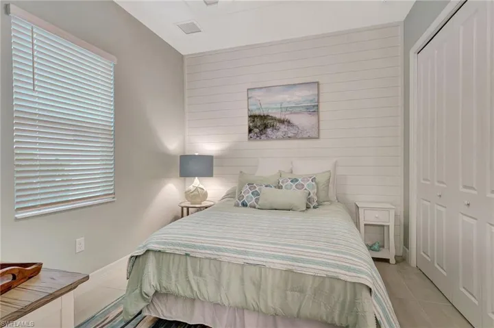Bedroom featuring a closet, and light tile patterned flooring