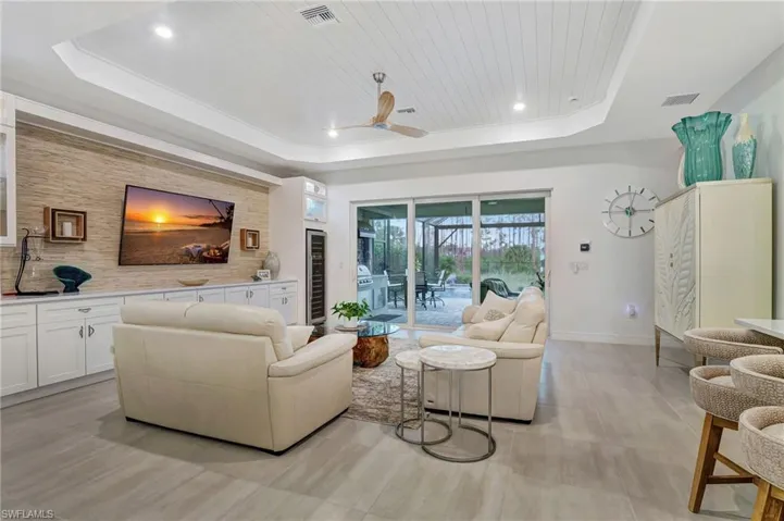 Living room featuring Custom Built Ins and Wine Cooler beverage cooler