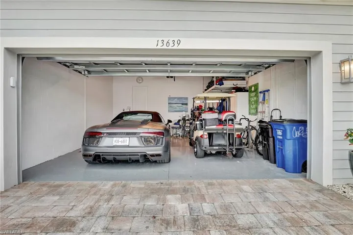Very Clean Garage with Ceiling Storage Unit