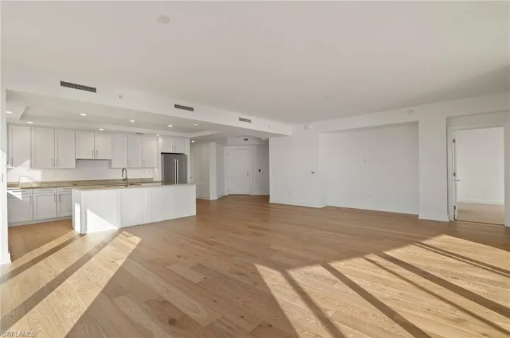 Bright and airy great room flows into dining and living room great space  for family gatherings and entertaining