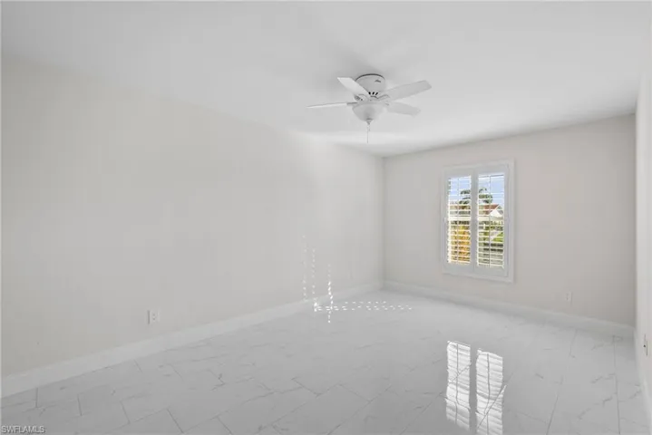 Spare room featuring ceiling fan