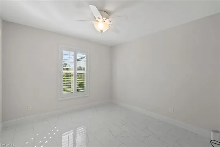 Spare room featuring ceiling fan