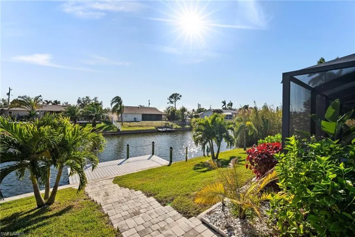 View of water feature with a dock