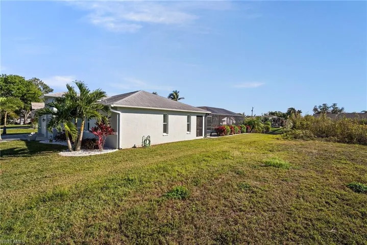 View of yard with a lanai