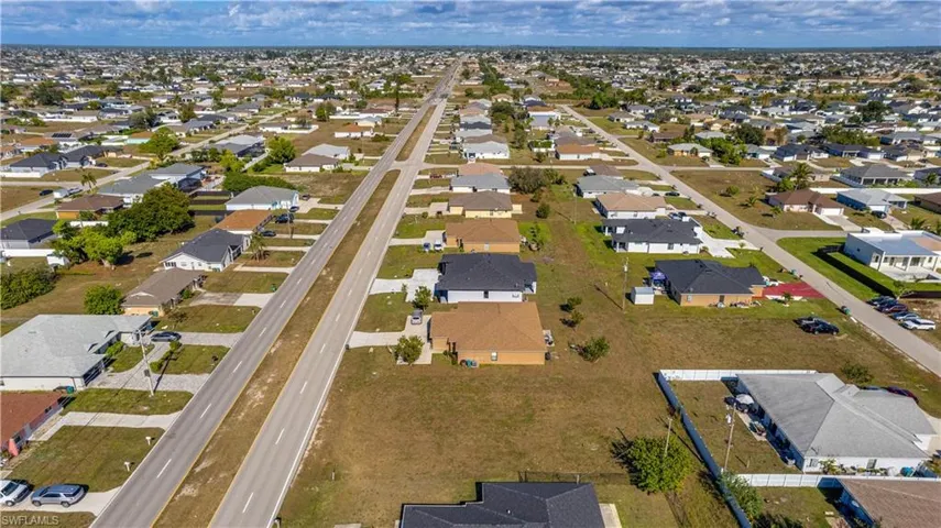 Aerial view of duplex lot property's location with nearby suburban area