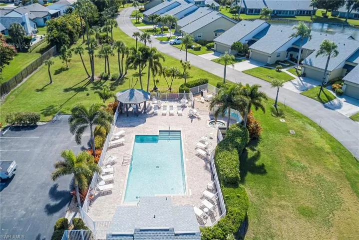 Aerial perspective of suburban area featuring a pool area