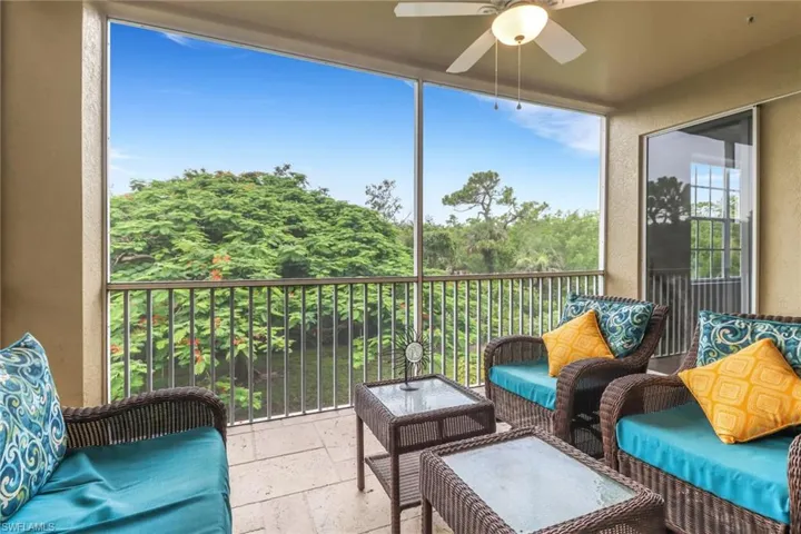 Sunroom featuring a ceiling fan