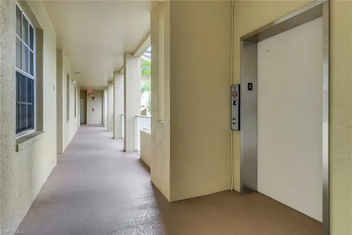 Corridor featuring elevator