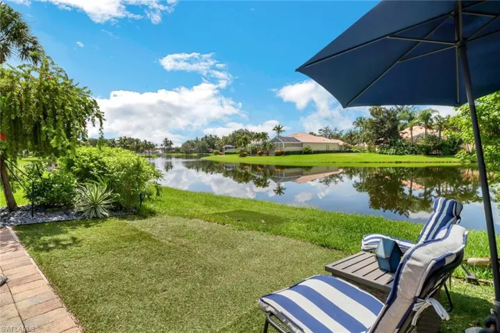 View of yard with a water view