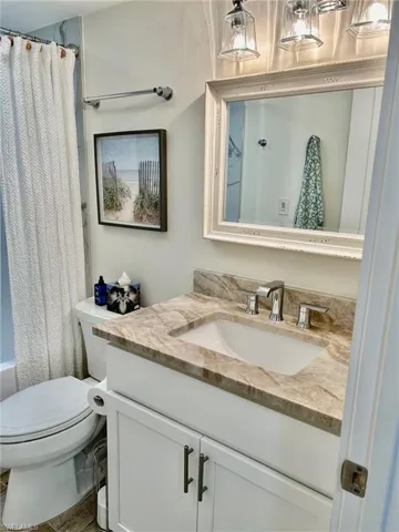 Bathroom featuring vanity and toilet