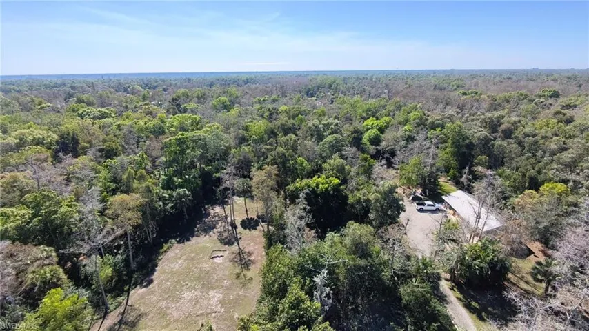 Aerial overview of property's location with a forest