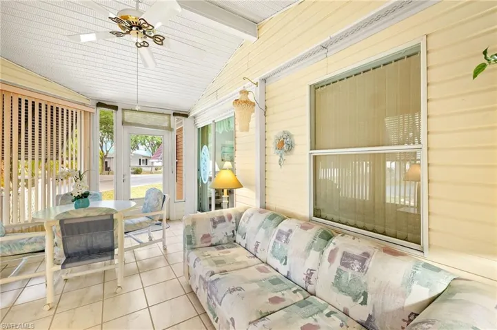 Sunroom / solarium with a ceiling fan