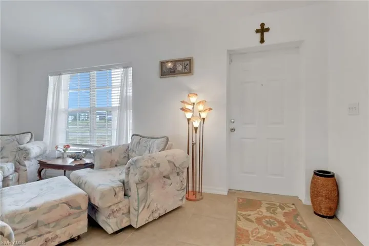 Living room featuring light tile patterned floors