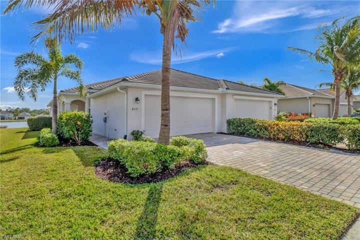 Attached Villa with 2-car garage and paver driveway