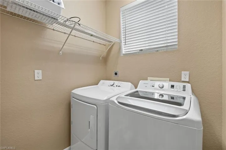 Laundry room featuring washing machine and dryer