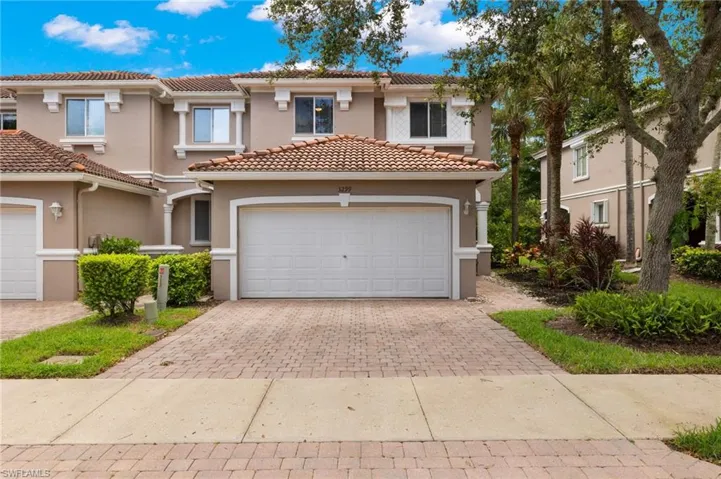 Mediterranean / spanish-style house with a garage