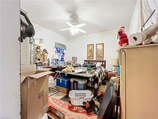 Bedroom featuring a ceiling fan
