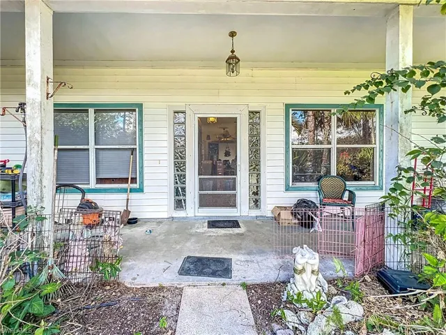 Property entrance featuring a patio