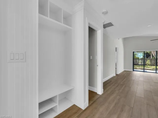 Custom Wainscoting & Catch-All In Foyer