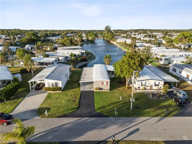 Aerial perspective of suburban area with a large body of water